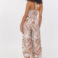 PRINTED RAYON HALTER JUMPSUIT - BRONZE PALM PRINT